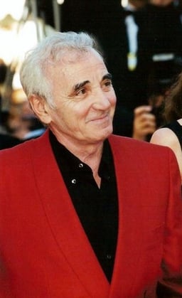 What genre of music is Aznavour primarily associated with?