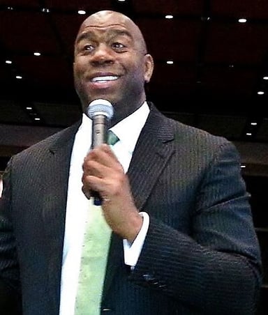 In which year was Magic Johnson inducted into the Naismith Memorial Basketball Hall of Fame for his individual career?