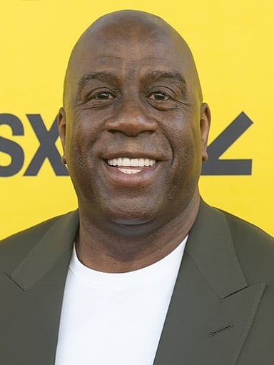How many NBA championships has Magic Johnson won as a player and a minority owner combined?