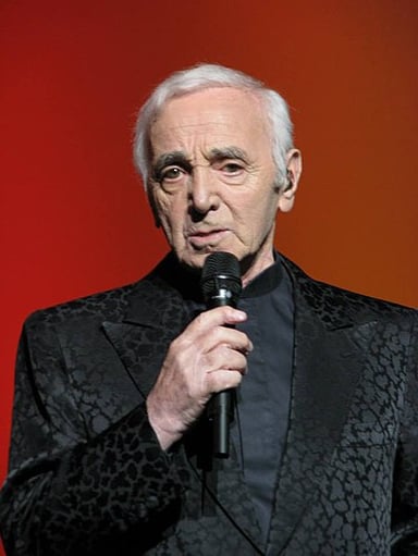 How many languages did Aznavour record songs in?
