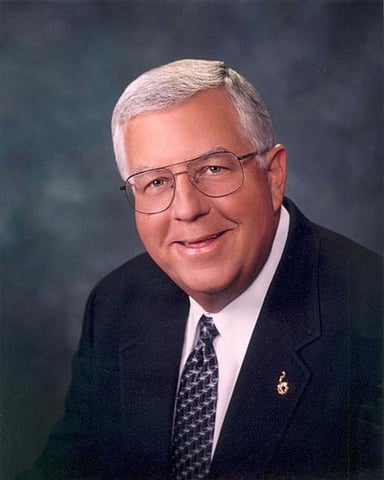 From which high school did Mike Enzi graduate?