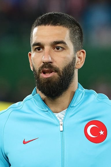 What was Turan's jersey number at Barcelona?
