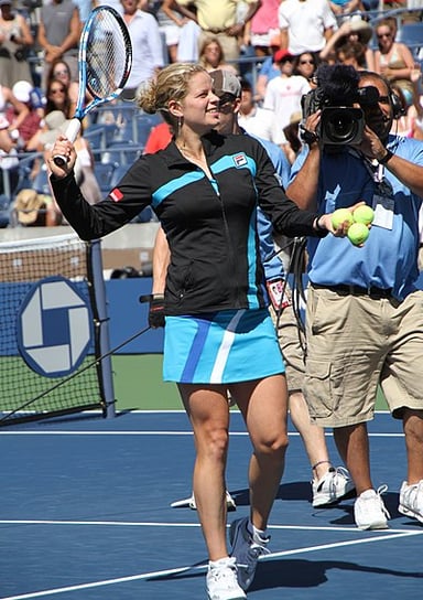 Who was Kim Clijsters' doubles partner when she won the Wimbledon and the French Open?