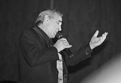 Which famous French artist once commented on Aznavour's influence on despair?