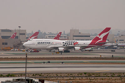 In which year did Qantas become a publicly listed company?
